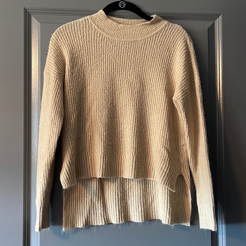 FashionNova beige knit sweater.